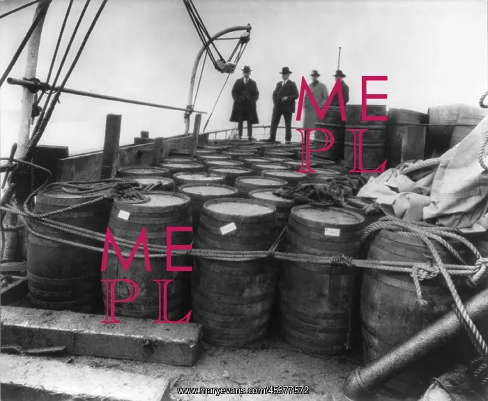 : Prohibition agents examining barrels on the : Prohibition agents examining barrels on the