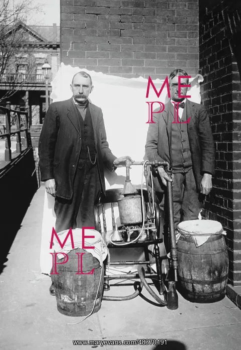 : Prohibition era photograph of two men posing with : Prohibition era photograph of two men posing with