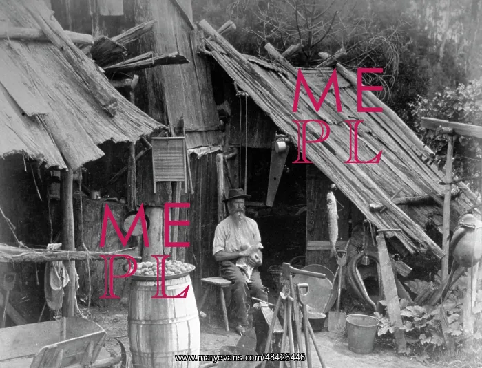 : Prospector sits in front of his prospectors hut : Prospector sits in front of his prospectors hut