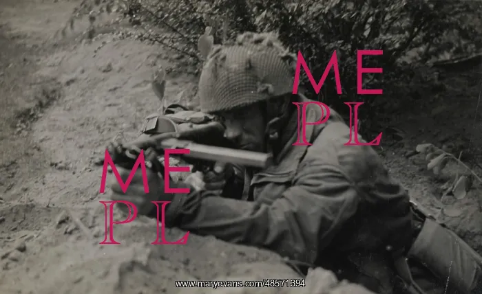 : Pte J Connington of Selby, Yorks, in action with Sten gun : Pte J Connington of Selby, Yorks, in action with Sten gun