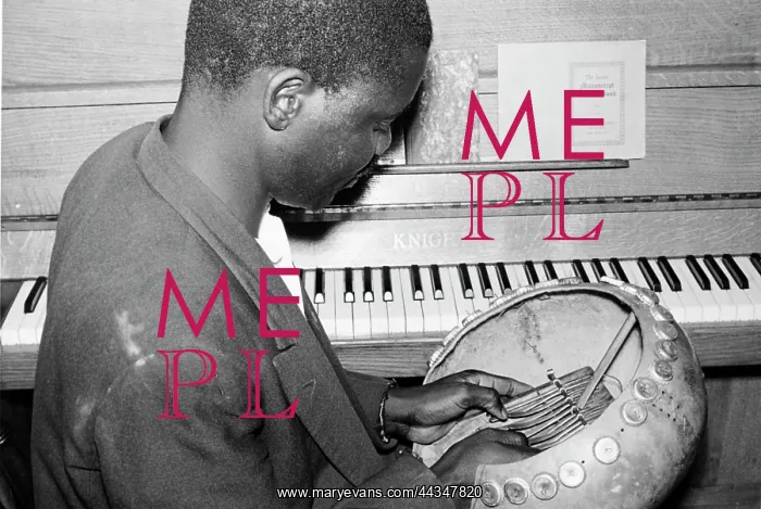 : A pupil attempts and play mbira, Mbira, Unknown : A pupil attempts and play mbira, Mbira, Unknown