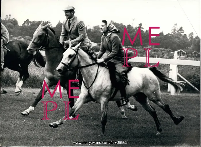 : Queen Elizabeth II riding on the course at Ascot : Queen Elizabeth II riding on the course at Ascot