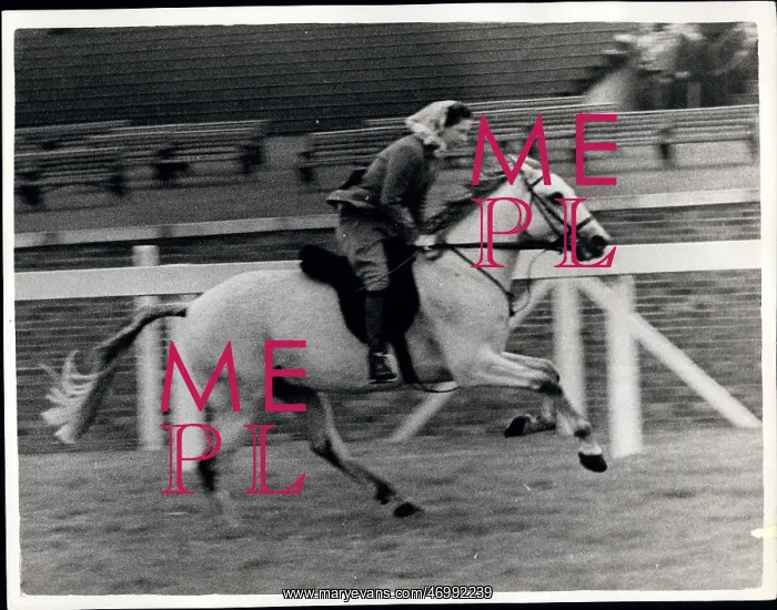 : Queen Elizabeth II riding on the course at Ascot : Queen Elizabeth II riding on the course at Ascot