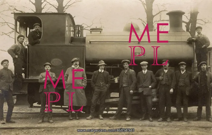  : Railway workers pose with steam engine