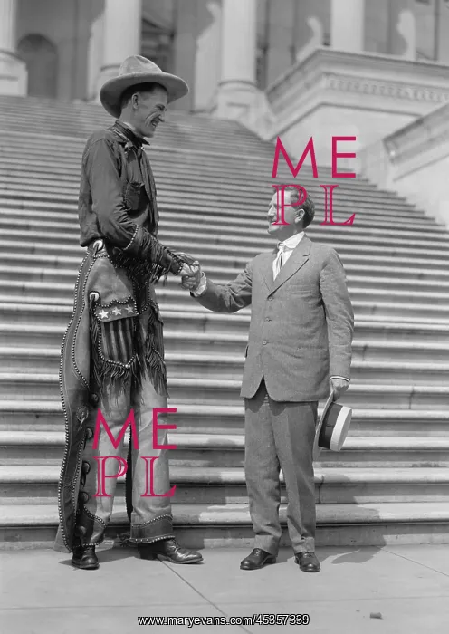 : Ralph E. Madsen, the Tall Cowboy, shaking hands : Ralph E. Madsen, the Tall Cowboy, shaking hands
