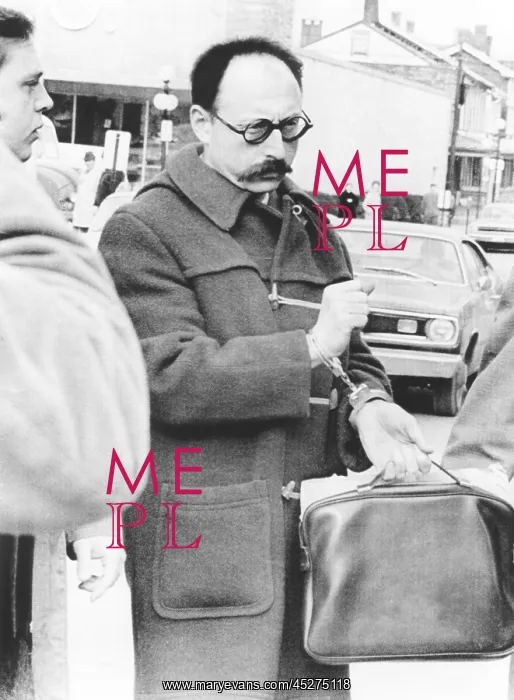 : Ralph Ginzburg in handcuffs as he is led to the : Ralph Ginzburg in handcuffs as he is led to the