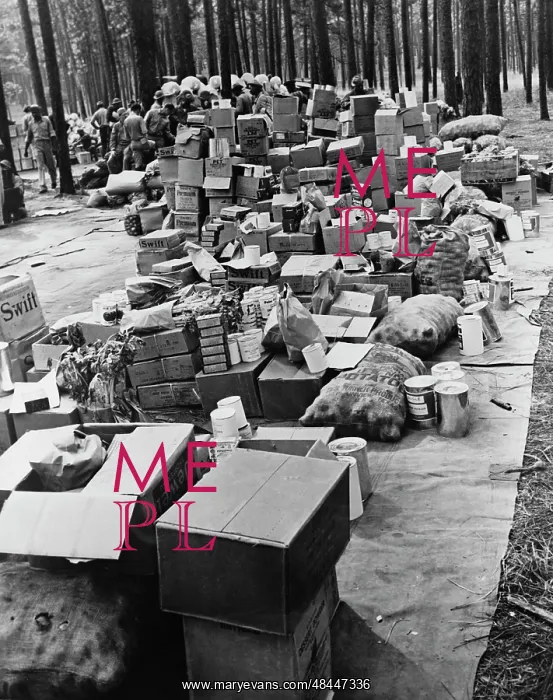 : Rations before being loaded into trucks during : Rations before being loaded into trucks during
