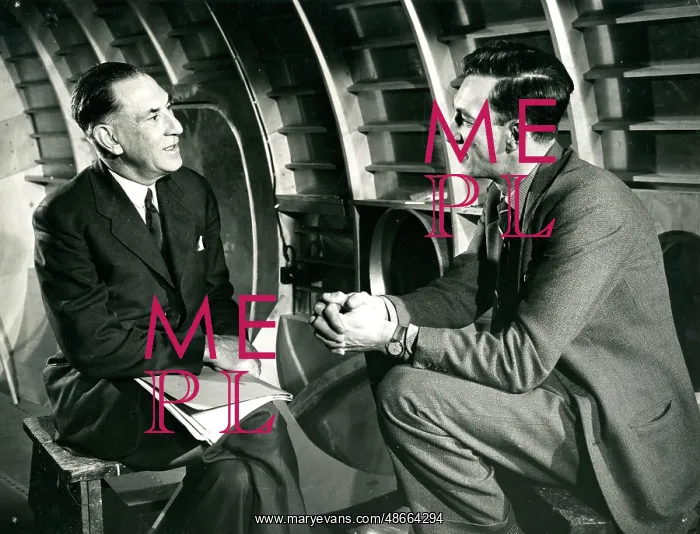 : Raymond Baxter conducting an interview : Raymond Baxter conducting an interview