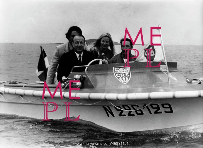 : Raymond Marcellin riding in a boat : Raymond Marcellin riding in a boat