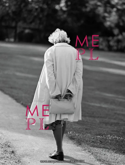 : Rear view of elderly woman walking down sidewalk : Rear view of elderly woman walking down sidewalk