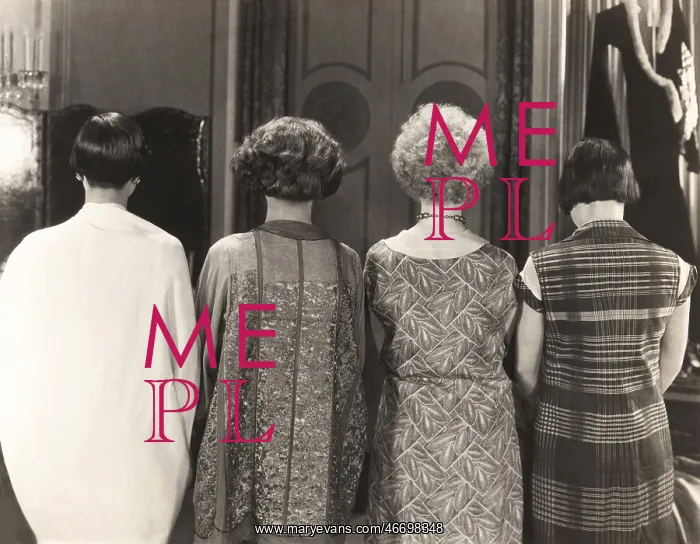 : Rear view of four women standing in a row : Rear view of four women standing in a row