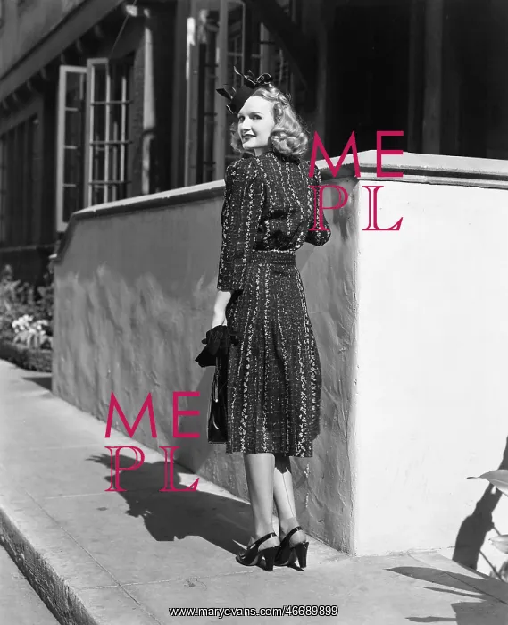 : Rear view of a young woman standing in front of : Rear view of a young woman standing in front of