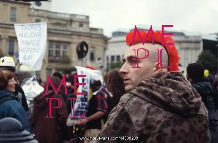 : Red mohican man at CND Rally : Red mohican man at CND Rally