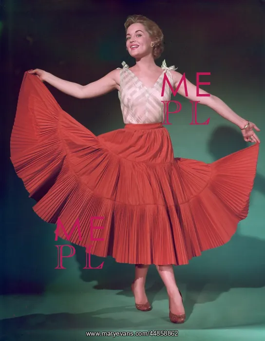 : RED SKIRT. She holds out her red full circle skirt : RED SKIRT. She holds out her red full circle skirt