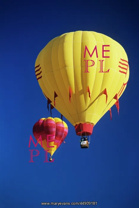  : Red and yellow hot air balloons in blue cloudless