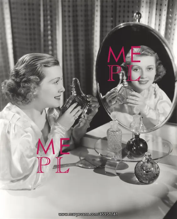 : Reflection of woman holding perfume atomizer in mirror : Reflection of woman holding perfume atomizer in mirror