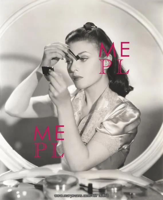 : Reflection of woman in mirror applying eye make-up : Reflection of woman in mirror applying eye make-up