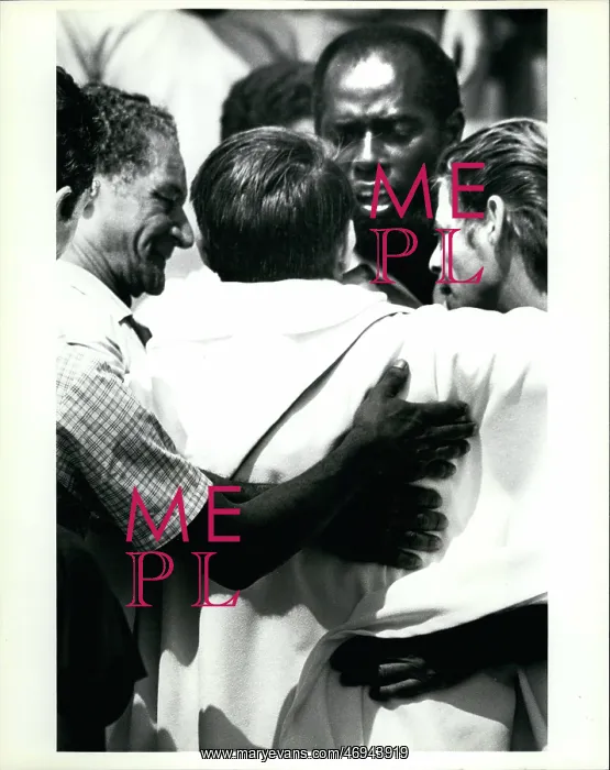 : Refugees. Feb. 25 A priest is embraced by Cuban refugees after he helped : Refugees. Feb. 25 A priest is embraced by Cuban refugees after he helped