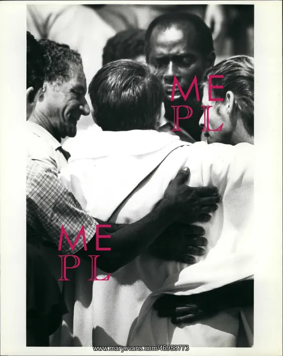 : Refugees. Mar. 22 A priest is embraced by Cuban refugee after he helped : Refugees. Mar. 22 A priest is embraced by Cuban refugee after he helped