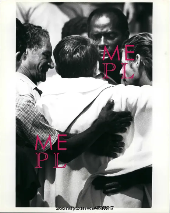 : Refugees. Mar. 22 A priest is embraced by Cuban refugees after he helped : Refugees. Mar. 22 A priest is embraced by Cuban refugees after he helped