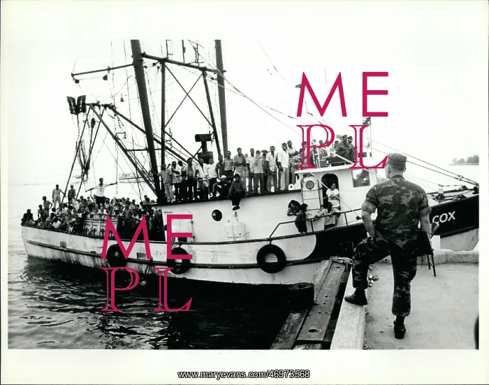 : Refugees. Apr. 18 A marine waits at the dockside in Key west for a boat : Refugees. Apr. 18 A marine waits at the dockside in Key west for a boat