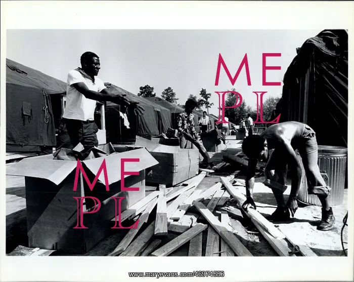 : Refugees. Cuban refugees pitch in to help clean up the area in the Tent : Refugees. Cuban refugees pitch in to help clean up the area in the Tent
