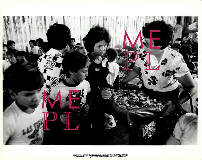 : Refugees. OPA Locka: Adult and Young Cuban refugees crowd around a volunteer : Refugees. OPA Locka: Adult and Young Cuban refugees crowd around a volunteer