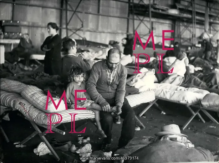 : Refugees. Mar. 04, 1960 - Refugees in Agadir Wait for Aid in Air Hanger : Refugees. Mar. 04, 1960 - Refugees in Agadir Wait for Aid in Air Hanger