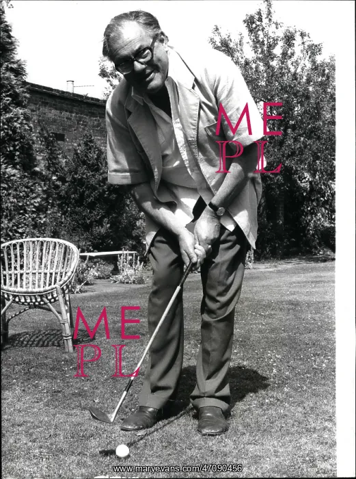 : Reginald Maudling playing golf in his garden : Reginald Maudling playing golf in his garden