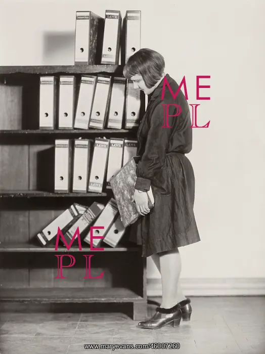  : Registrar. Girl with bob storing Leitz-folders into a shelf