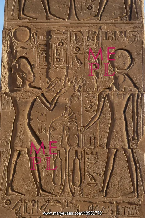 : Relief depicting a Pharaoh making offerings to the god Ra. R : Relief depicting a Pharaoh making offerings to the god Ra. R