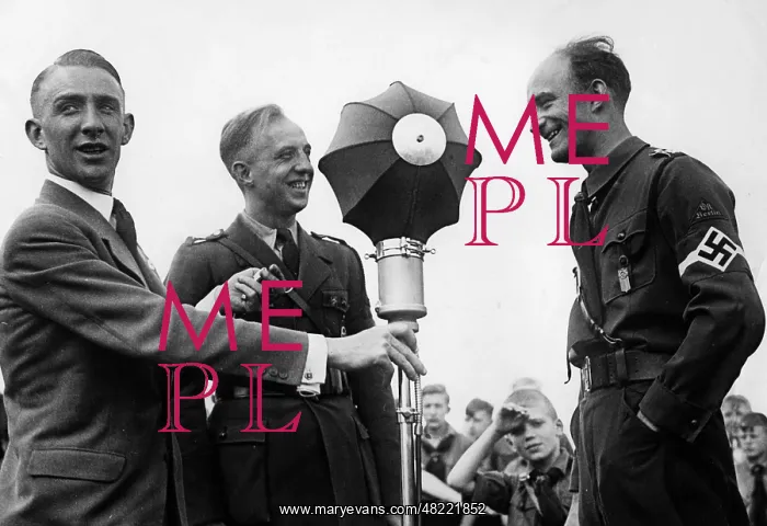: A reporter is interviewing Gebietsfuehrer Erich Jahn, 19 : A reporter is interviewing Gebietsfuehrer Erich Jahn, 19