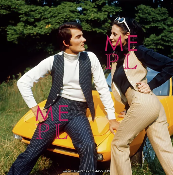 : Retro couple modelling pin striped suits : Retro couple modelling pin striped suits