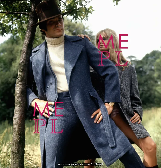 : Retro couple modelling winter coats, 1970s : Retro couple modelling winter coats, 1970s