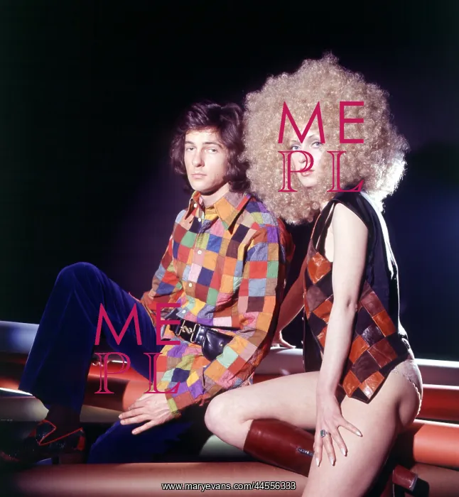  : Retro couple posing in matching outfits 1970s