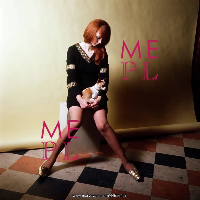 : Retro Red headed model holding small dog : Retro Red headed model holding small dog