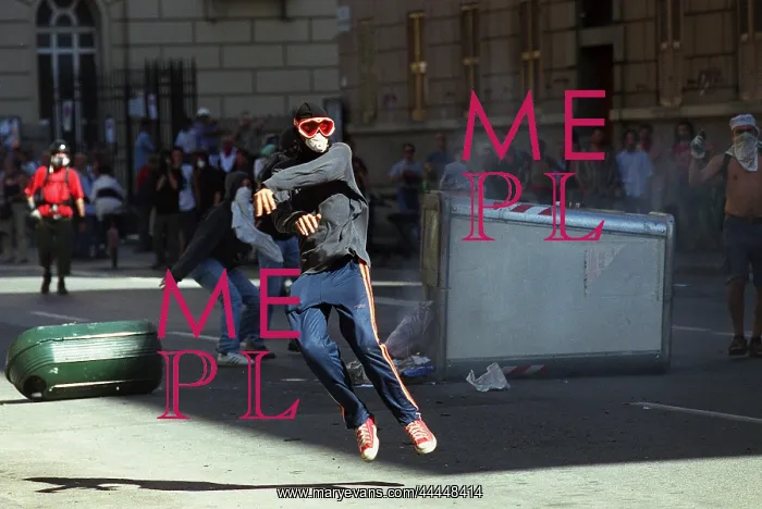 : Rioter Throws Stones : Rioter Throws Stones