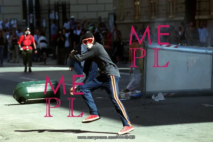 : Rioter Throws Stones : Rioter Throws Stones