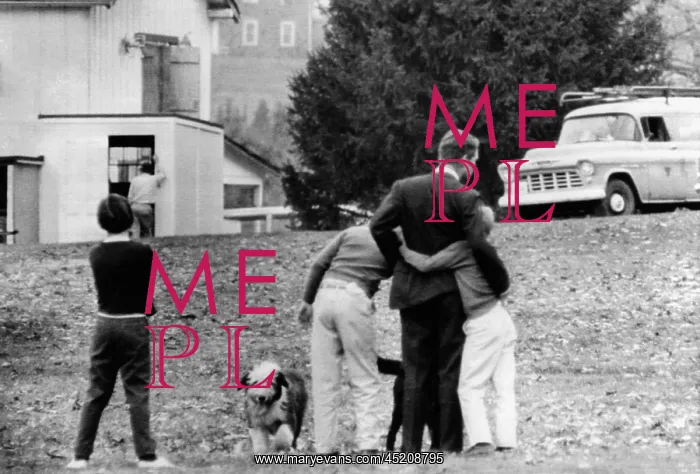 : Robert Kennedy is comforted by two of his ? : Robert Kennedy is comforted by two of his ?