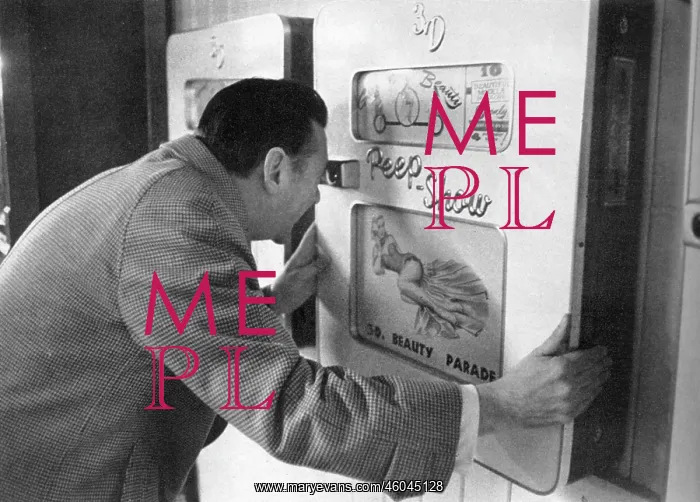: Robin Maugham looking at a peep-show in Brighton : Robin Maugham looking at a peep-show in Brighton