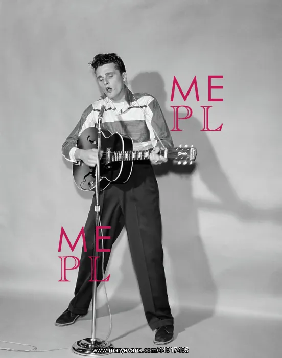 : Rockabilly singer in front of microphone strumming : Rockabilly singer in front of microphone strumming