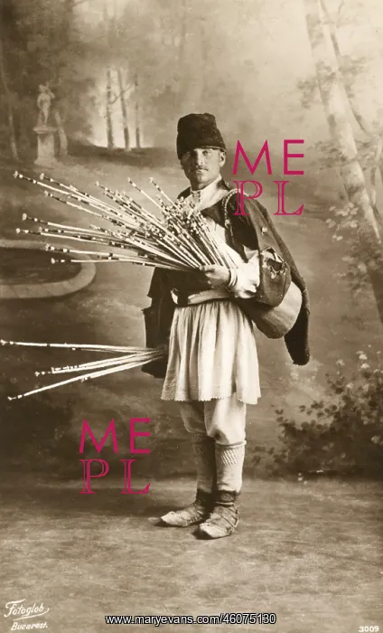 : Romanian man with bunch of thin sticks : Romanian man with bunch of thin sticks