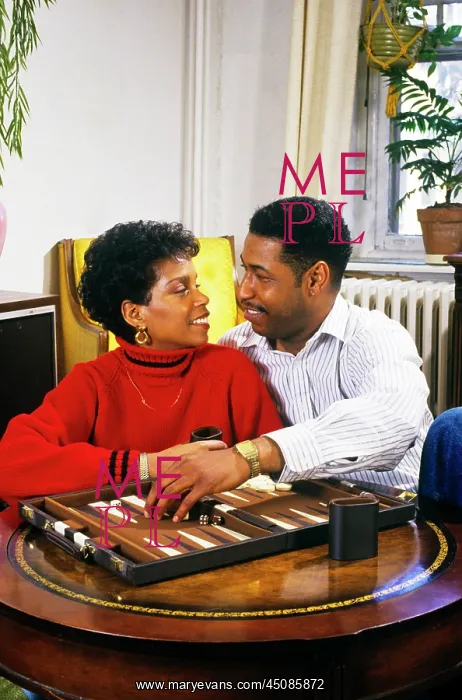 : Romantic African-American Couple Playing Backgammon : Romantic African-American Couple Playing Backgammon