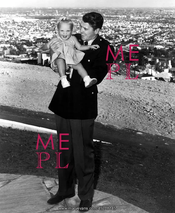 : Ronald Reagan holding Maureen Reagan, 1943. ? : Ronald Reagan holding Maureen Reagan, 1943. ?