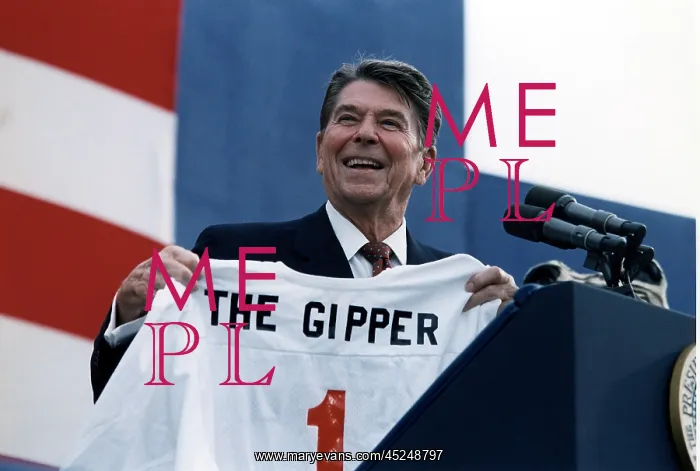 : Ronald Reagan. President Reagan holding a Gipper : Ronald Reagan. President Reagan holding a Gipper