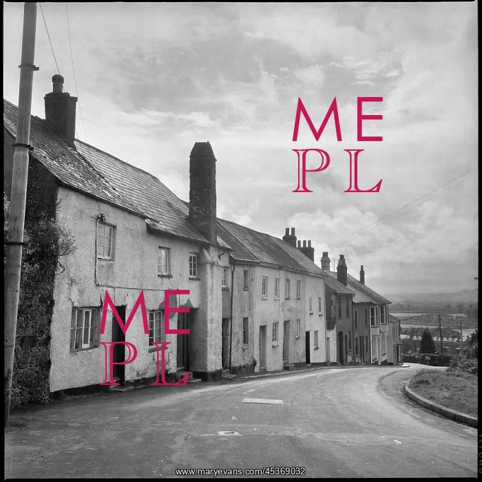 : A row of cottages stepping down a hill towards : A row of cottages stepping down a hill towards