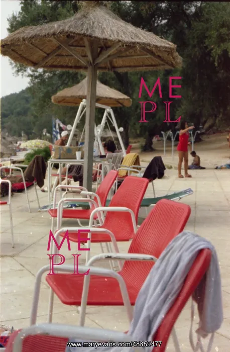: A row of red beach chairs, Corfu : A row of red beach chairs, Corfu