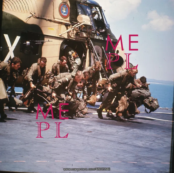 : Royal Marine Commandos re-embarking from a Westland Wess : Royal Marine Commandos re-embarking from a Westland Wess