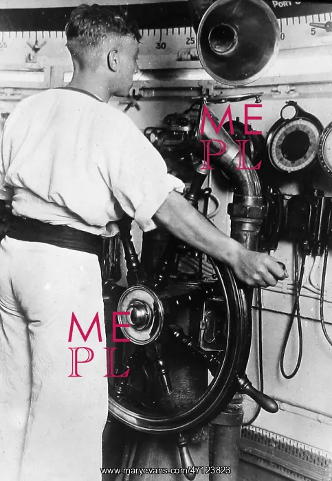  : Royal Navy helmsman at the wheel probably 1930s