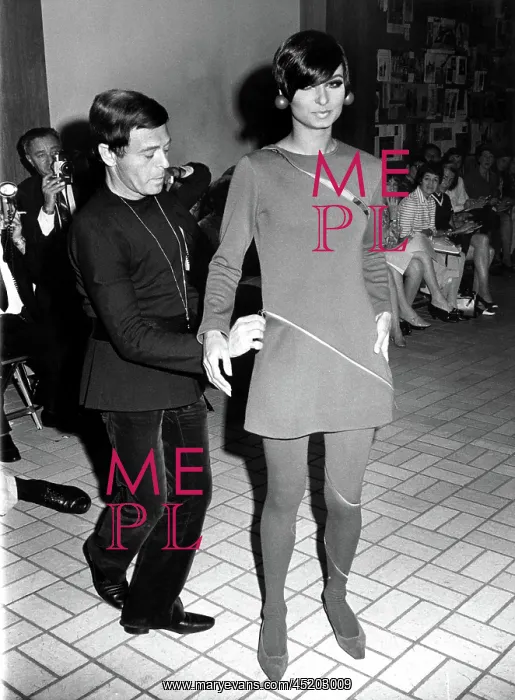 : Rudi Gernreich dressing a model at a New ? : Rudi Gernreich dressing a model at a New ?